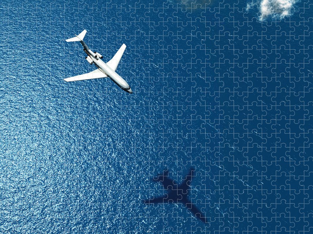Atmosphere Jigsaw Puzzle featuring the photograph Airplane Flies Over A Sea by Photobank Gallery