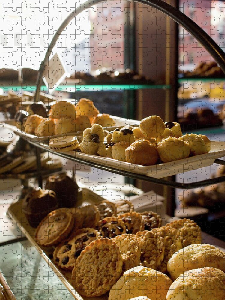 Baked Pastry Item Jigsaw Puzzle featuring the photograph Assorted Pastries On Display In A Cafe by David Mcglynn