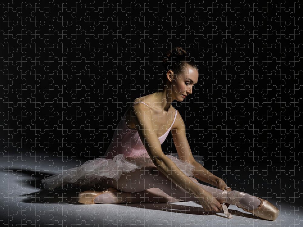 Tranquility Jigsaw Puzzle featuring the photograph Ballerina Tying Pointe Shoe Ribbon by Nisian Hughes