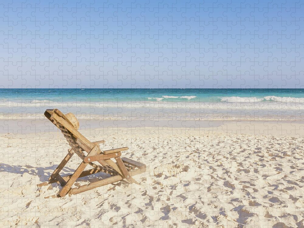 Tranquility Jigsaw Puzzle featuring the photograph Beach Chair With Hat On Beach Next To by Sasha Weleber