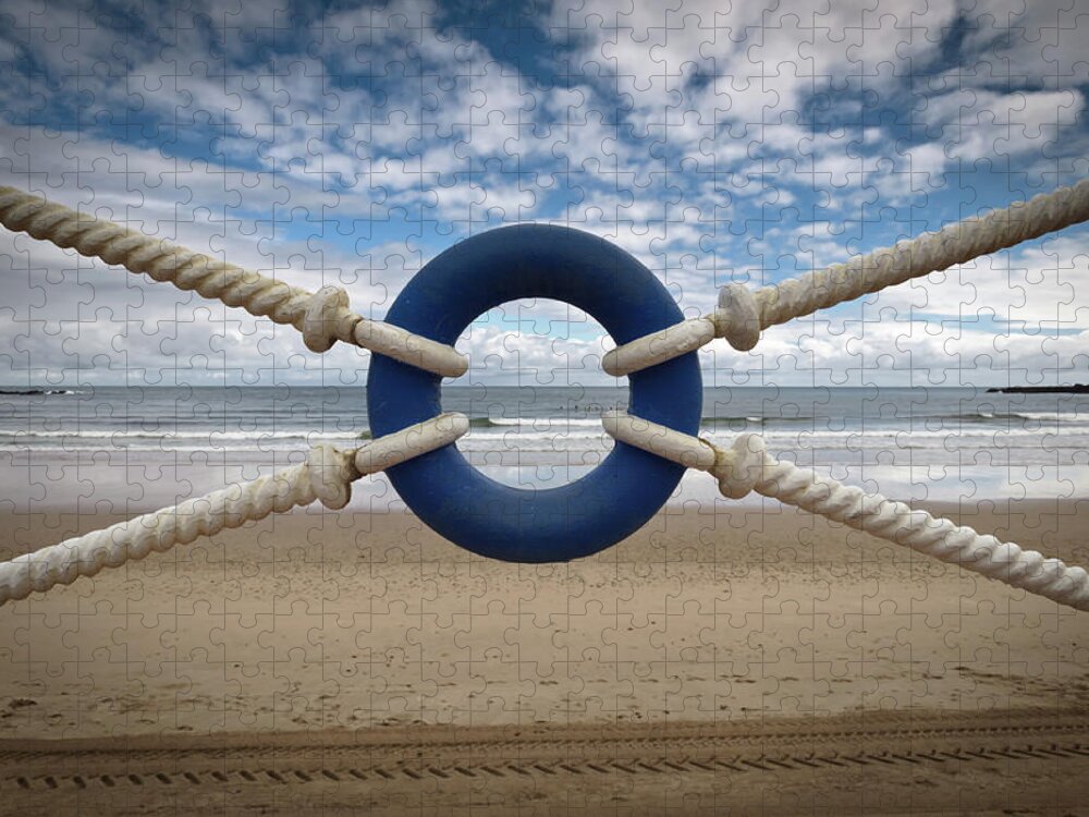 Water's Edge Jigsaw Puzzle featuring the photograph Beach Through Lifeguard Tied With Ropes by Carlos Ramos