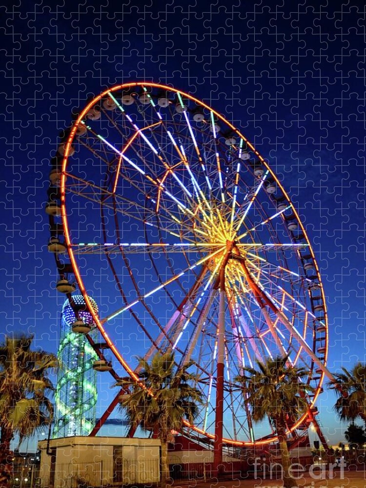 Night Jigsaw Puzzle featuring the photograph Brightly lit ferris wheel and Alphabet Tower at night in amusement park area Batumi Georgia by Imran Ahmed