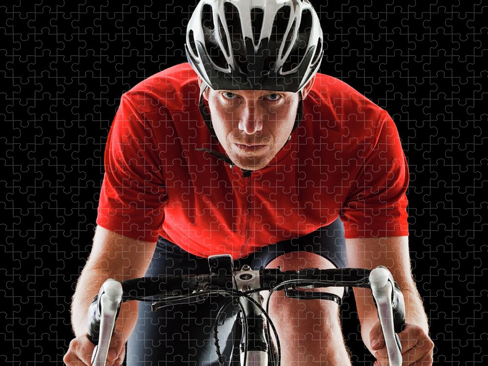 Sports Helmet Jigsaw Puzzle featuring the photograph Caucasian Man Riding Bicycle by Mike Kemp
