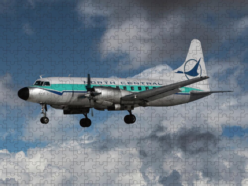 North Central Airlines Jigsaw Puzzle featuring the photograph Classic North Central CV-580 Landing at Minneapolis by Erik Simonsen