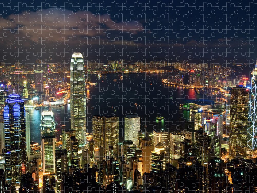 Population Explosion Jigsaw Puzzle featuring the photograph Classic View Of Hong Kong Skyline At by Tom Bonaventure