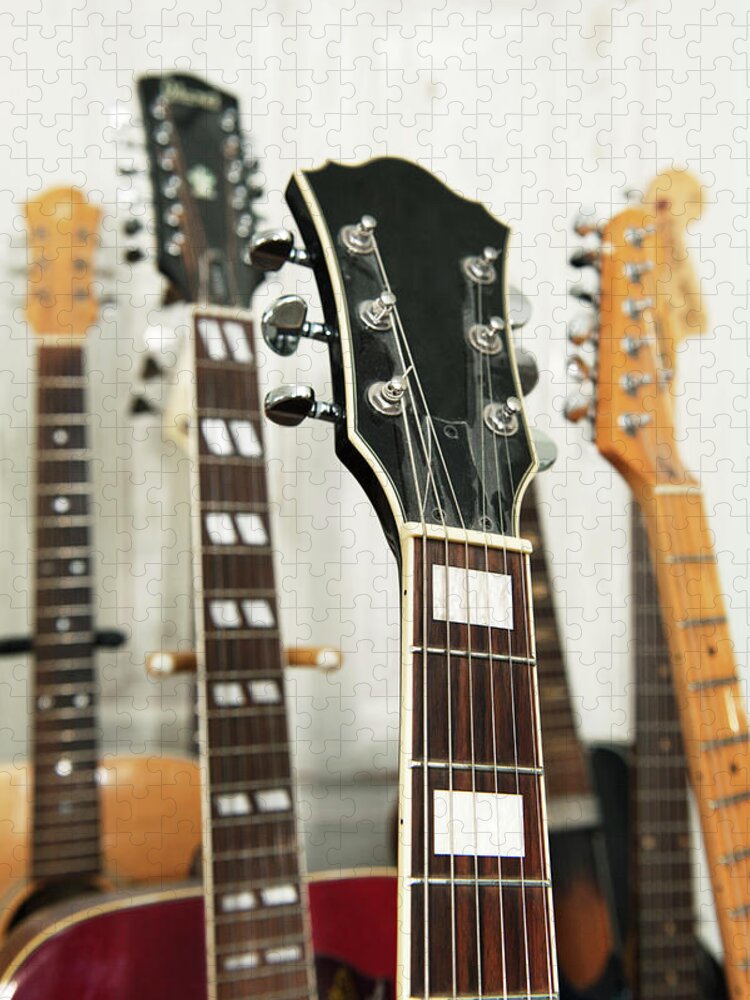 Recreational Pursuit Jigsaw Puzzle featuring the photograph Close Up Of Various Guitars by Johner Images