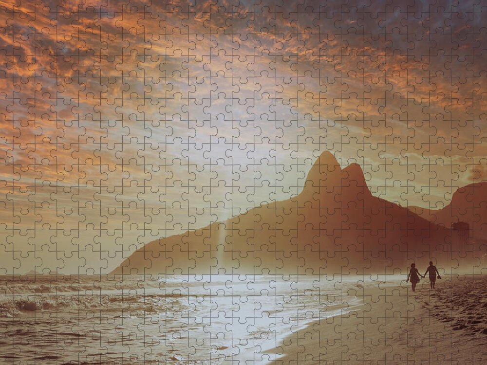 Water's Edge Jigsaw Puzzle featuring the photograph Couple On The Beach At Sunset by Buena Vista Images