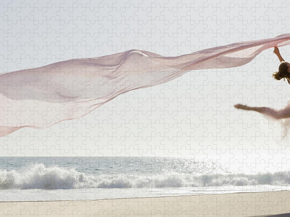 Ballet Dancer Jigsaw Puzzle featuring the photograph Dancer Leaping On Beach by Tetra Images - Pt Images