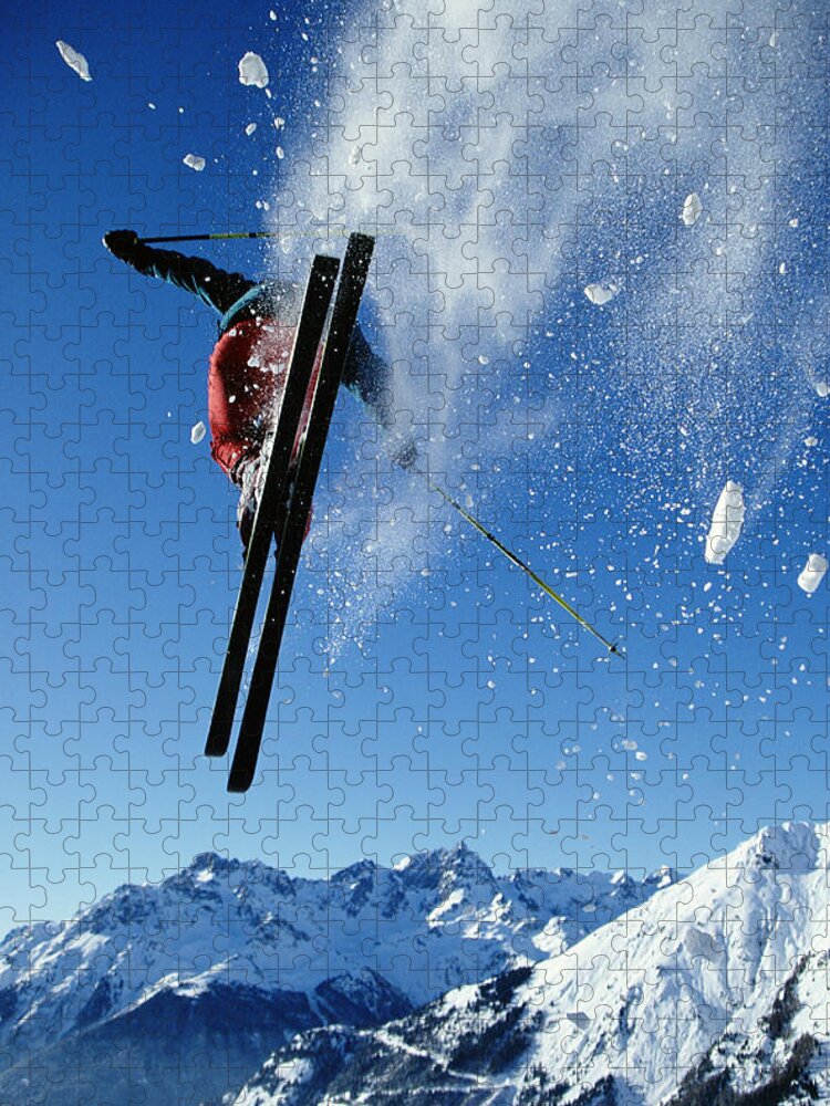 Skiing Jigsaw Puzzle featuring the photograph Downhill Skier In Mid-air, Rear View by Ross Woodhall