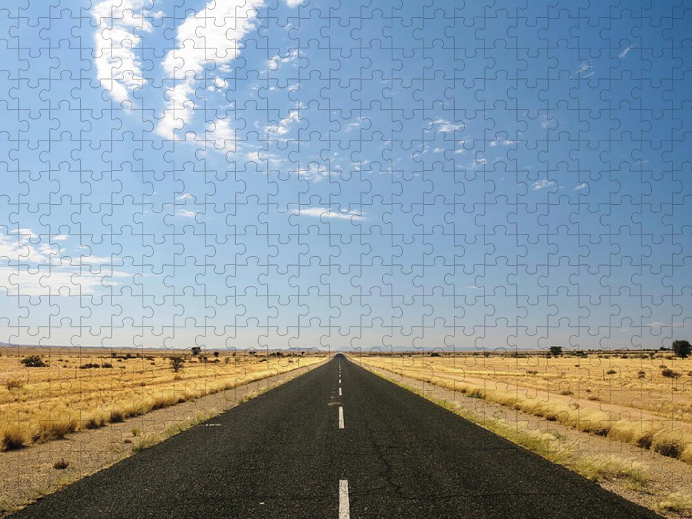 Scenics Jigsaw Puzzle featuring the photograph Empty Road Through Desert, Karas by Andy Nixon