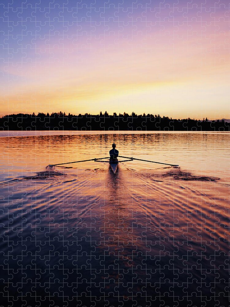 Tranquility Jigsaw Puzzle featuring the photograph Female Rowing Single Scull, Sunrise by Thomas Barwick