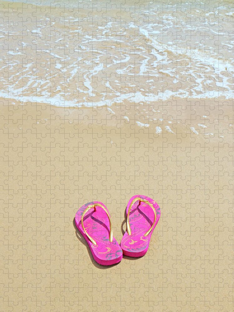 Water's Edge Jigsaw Puzzle featuring the photograph Flip Flops On A Sandy Beach by Kathy Collins