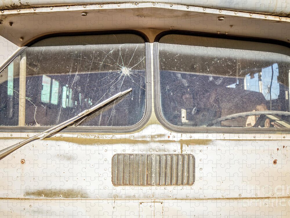 Junkyard Jigsaw Puzzle featuring the photograph Front of an old Bus in a junkyard by Edward Fielding