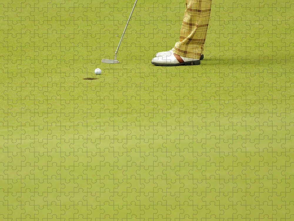 Grass Jigsaw Puzzle featuring the photograph Golfer Putts A Golf Ball Into A Hole by Photo © Stephen Chung