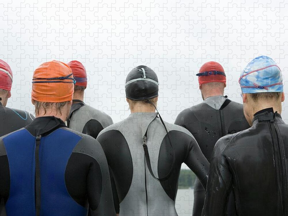 People Jigsaw Puzzle featuring the photograph Group Of Triathletes Standing By Lake by Lothar Schulz