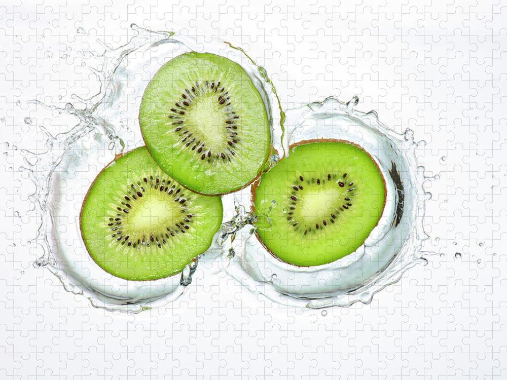 White Background Jigsaw Puzzle featuring the photograph Kiwi Slices Splash by Chris Stein