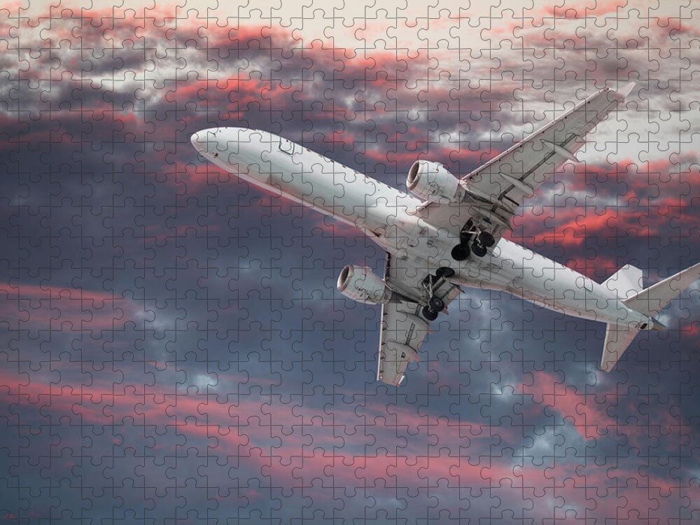 Below Jigsaw Puzzle featuring the photograph Large Passenger Airplane Flying In A by Buzbuzzer