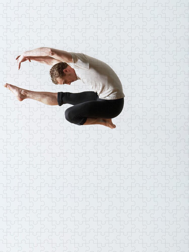 Ballet Dancer Jigsaw Puzzle featuring the photograph Leaping Ballet Dancer In Mid-air by Moodboard