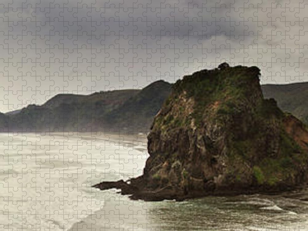Water's Edge Jigsaw Puzzle featuring the photograph Lion Rock At Piha Beach by Tomas Stehlik