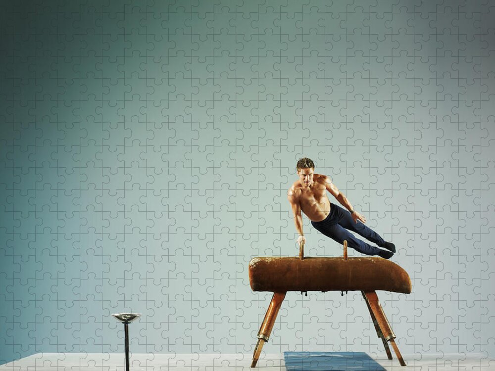 One Man Only Jigsaw Puzzle featuring the photograph Male Athlete Using A Pommel Horse by 10'000 Hours