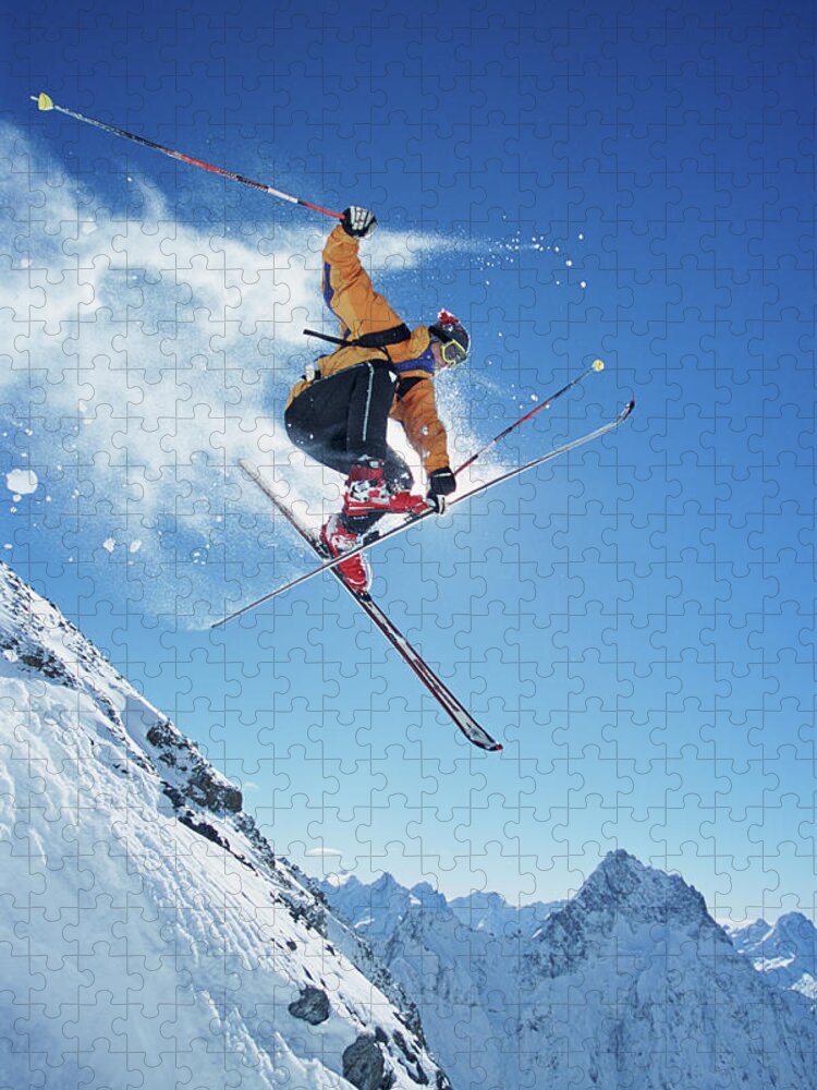 Skiing Jigsaw Puzzle featuring the photograph Male Skier In Mid-air, Low Angle View by Jakob Helbig