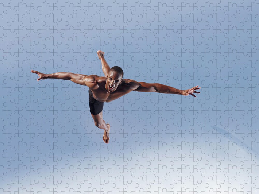 Human Arm Jigsaw Puzzle featuring the photograph Man Jumping by Martin Barraud