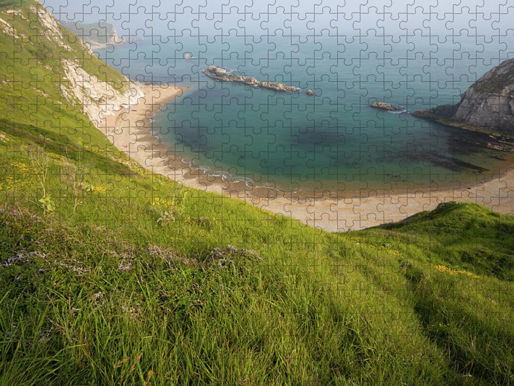 Water's Edge Jigsaw Puzzle featuring the photograph Man Of War Bay In Dorset, England by Davidcallan