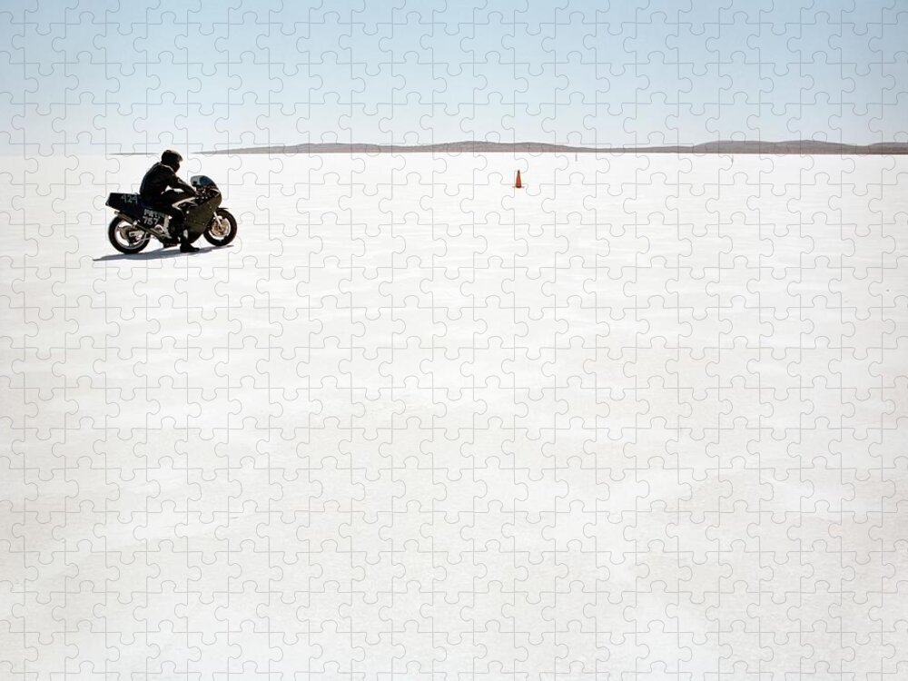 Crash Helmet Jigsaw Puzzle featuring the photograph Man Sitting On Motorcycle On Salt Flat by Tobias Titz