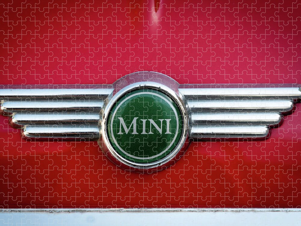 Mini Jigsaw Puzzle featuring the photograph Mini Cooper car logo on red surface by Michalakis Ppalis