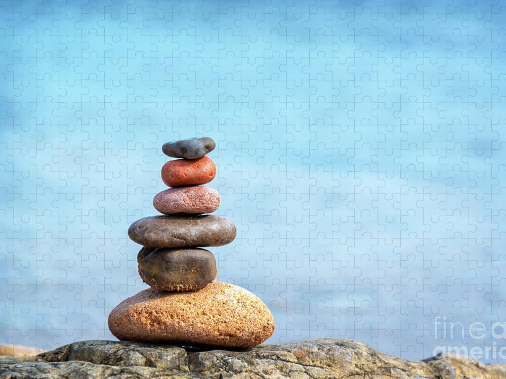 Balanced Jigsaw Puzzle featuring the photograph Pile of beach pebbles by Delphimages Photo Creations