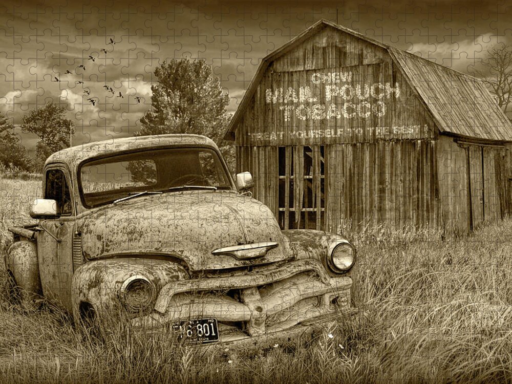 Chevy Jigsaw Puzzle featuring the photograph Sepia Tone of Rusted Chevy Pickup Truck in a Rural Landscape by a Mail Pouch Tobacco Barn by Randall Nyhof