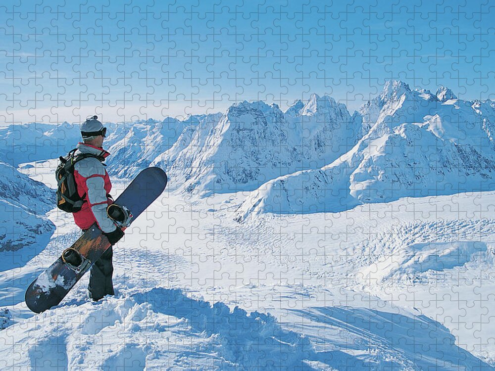 Three Quarter Length Jigsaw Puzzle featuring the photograph Side View Of A Snowboarder Looking At by Digital Vision.