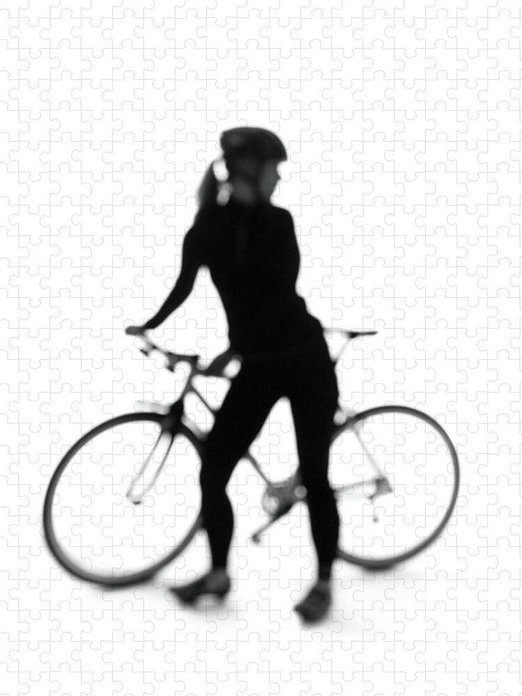 Recreational Pursuit Jigsaw Puzzle featuring the photograph Silhouette Of A Woman With A Bicycle by Peter Rutherhagen