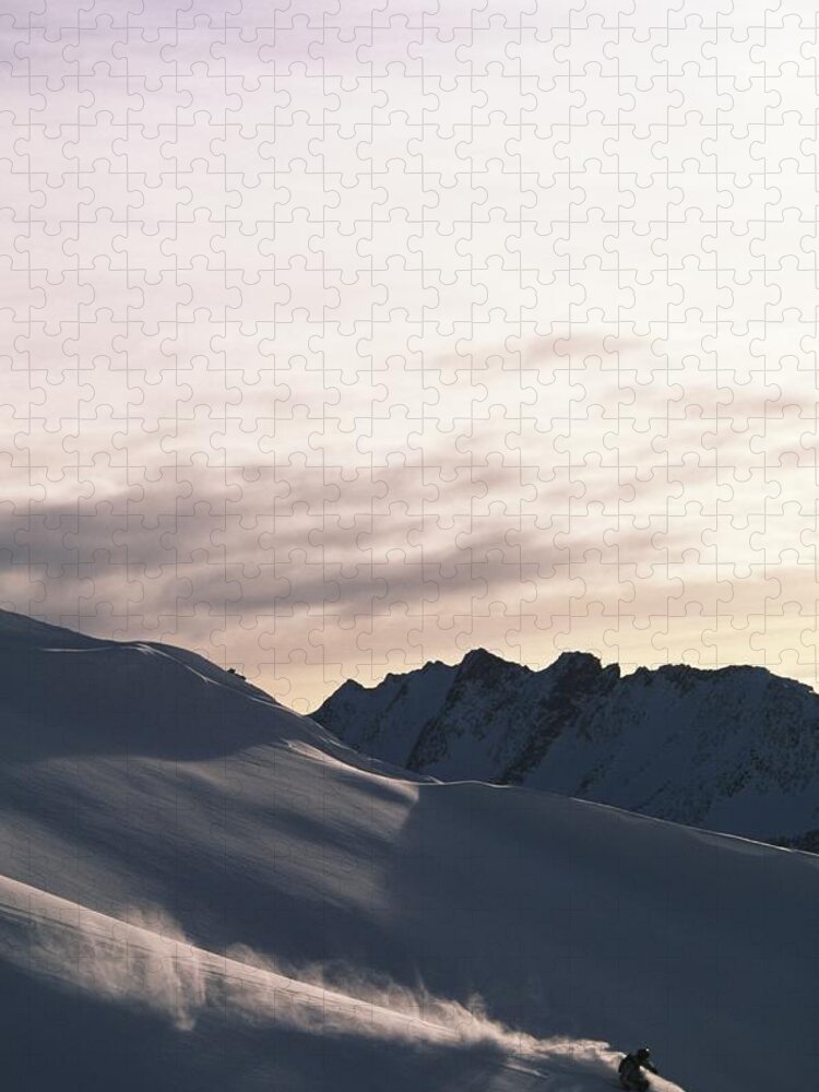 Snow Jigsaw Puzzle featuring the photograph Snowboarder On Mountain Snowboarding by Rubberball/adam Clark