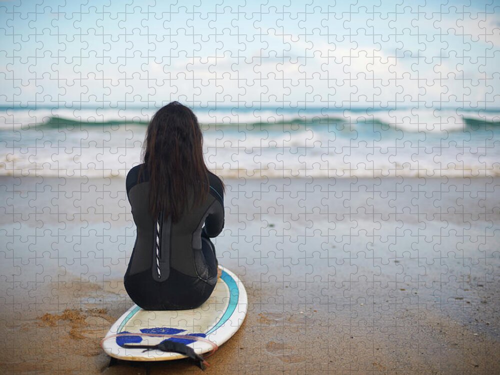 Tranquility Jigsaw Puzzle featuring the photograph Surfer Sitting On Board On Beach by Peter Muller