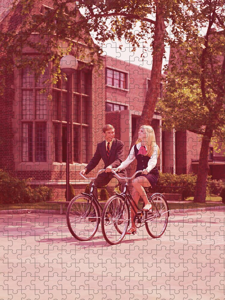 Heterosexual Couple Jigsaw Puzzle featuring the photograph Teenage Couple Riding Bicycles Past by H. Armstrong Roberts