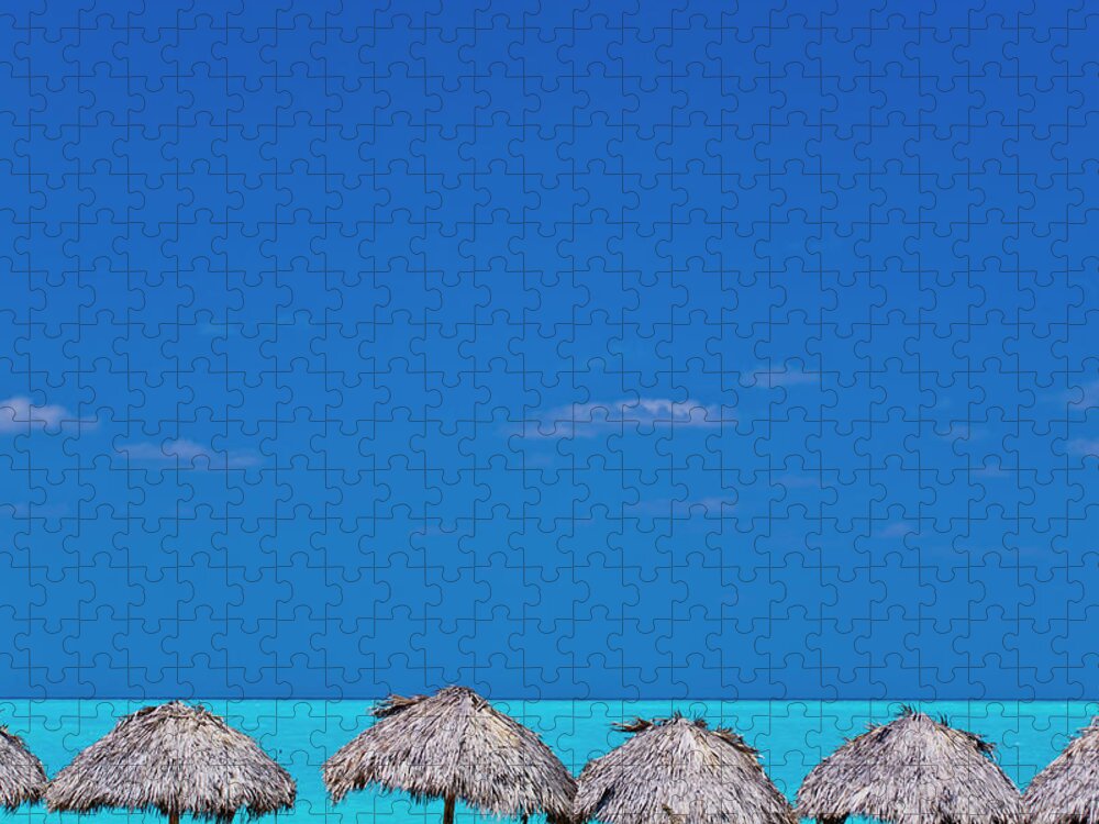 Tranquility Jigsaw Puzzle featuring the photograph Tiki Huts Along Tropical Beach by Stuart Dee