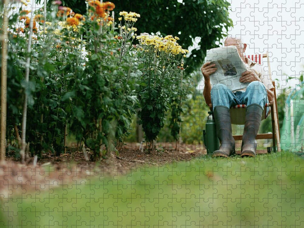 Grass Jigsaw Puzzle featuring the photograph Unrecognisable Man Sits Reading A by Iain Crockart