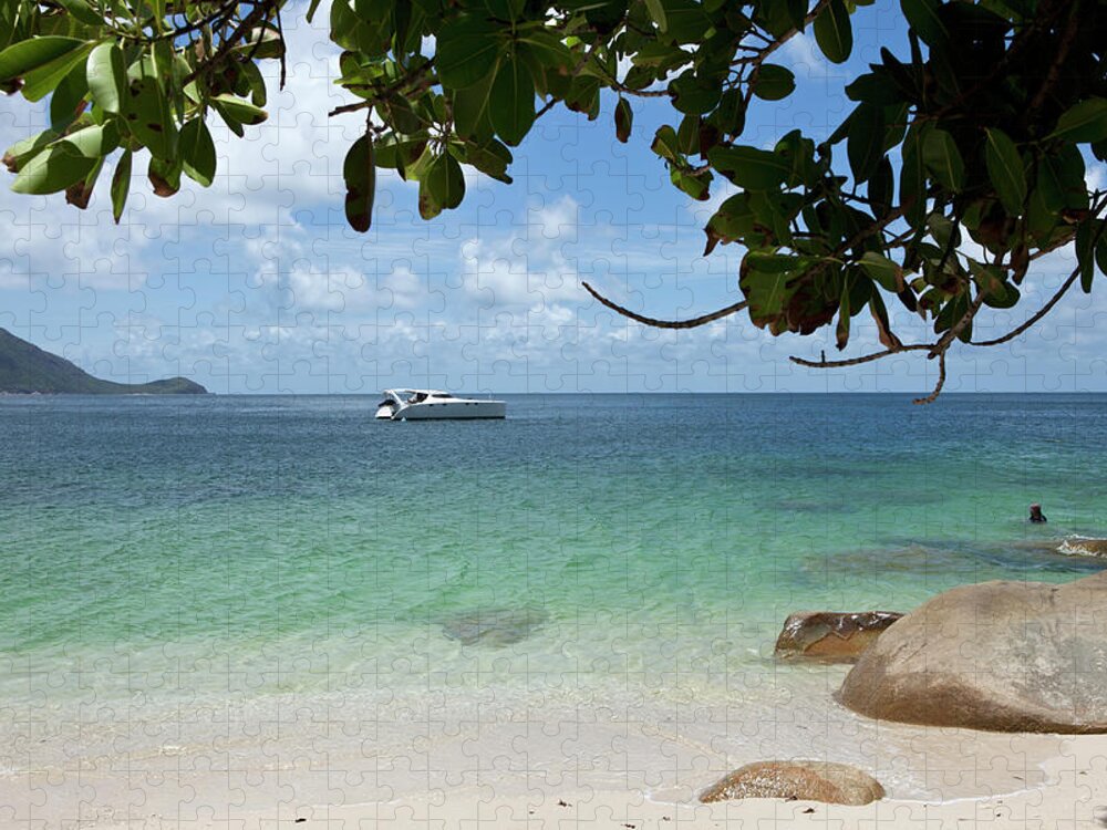 Water's Edge Jigsaw Puzzle featuring the photograph View From A Beach Of A Speedboat In The by Caspar Benson