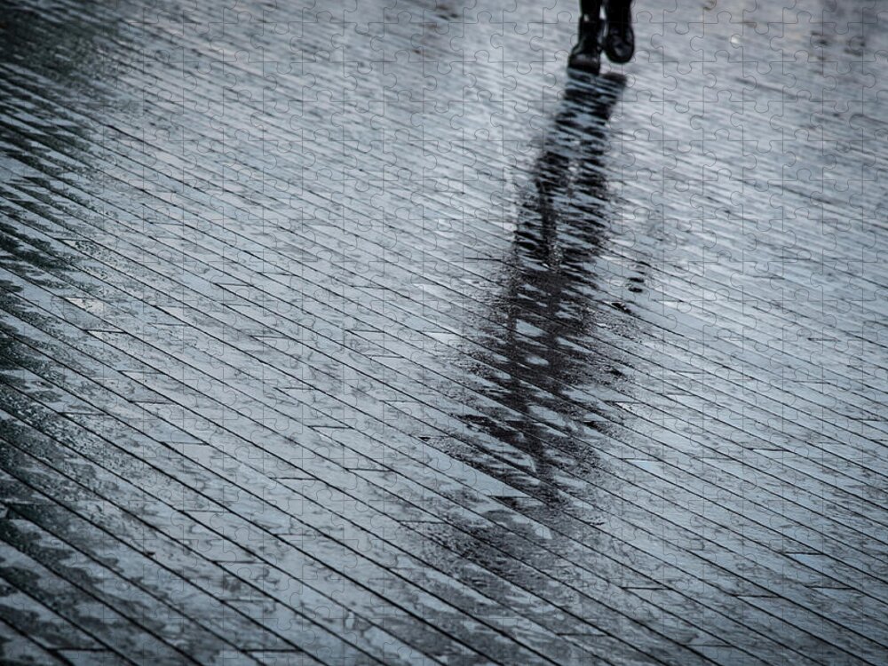 Silhouette Jigsaw Puzzle featuring the photograph Walking shadow of an unrecognised person walking on wet streets by Michalakis Ppalis