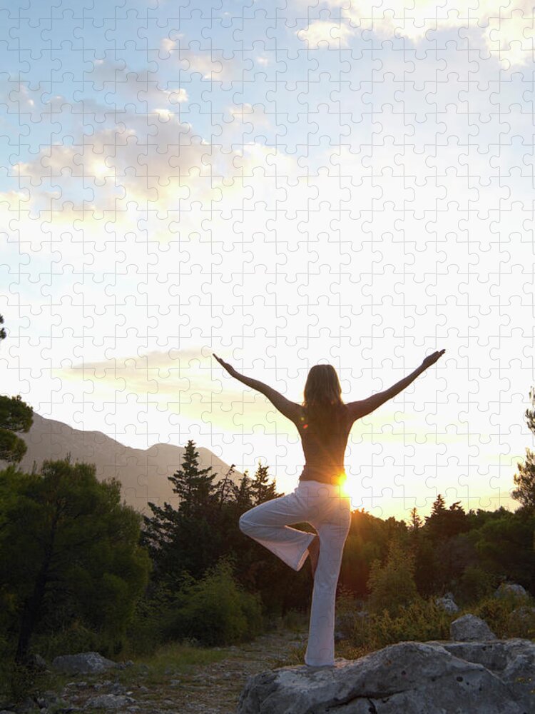 Human Arm Jigsaw Puzzle featuring the photograph Young Woman Balancing On Rock by Janie Airey