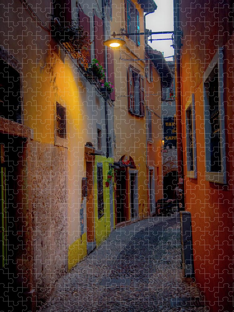 Tourism Jigsaw Puzzle featuring the photograph A Quiet Stroll in Malcesine by W Chris Fooshee