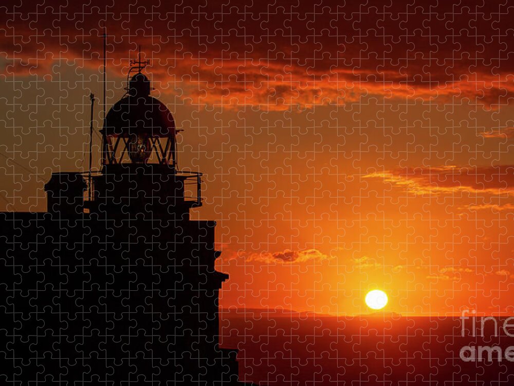 Night Jigsaw Puzzle featuring the photograph Cape Prior Silhouetted Lighthouse against Orange Sky Sunset and Sun at the Horizon Ferrol La Corua Galicia by Pablo Avanzini