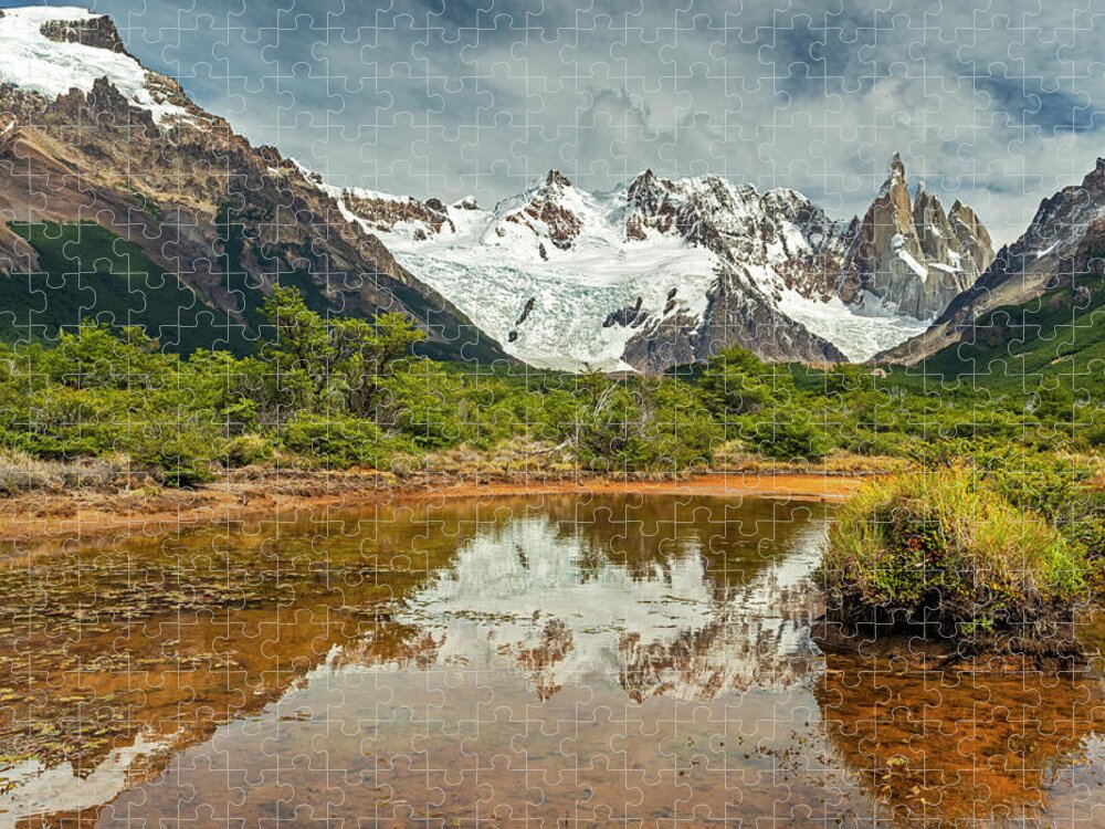 Andes Jigsaw Puzzle featuring the photograph Cerro Torre reflecting in a pond by Henri Leduc