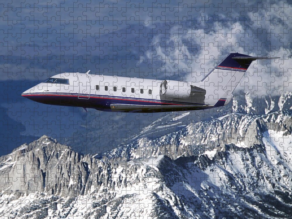 Challenger Business Jet Jigsaw Puzzle featuring the mixed media Challenger Corporate Jet over Snowcapped Mountains by Erik Simonsen