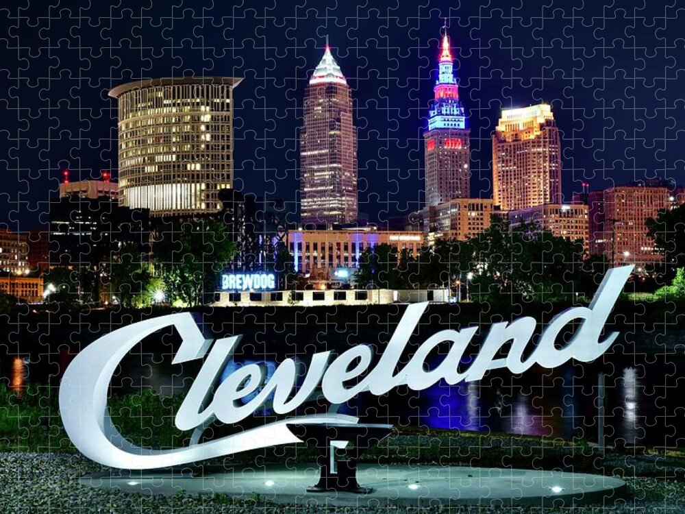 Cleveland Jigsaw Puzzle featuring the photograph CLE with Sign Along the Cuyahoga River by Frozen in Time Fine Art Photography