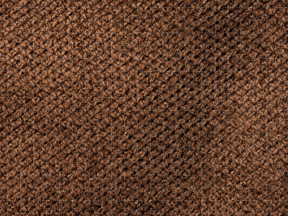 Crumpled dark brown fabric texture, wavy wrinkled cloth pattern
