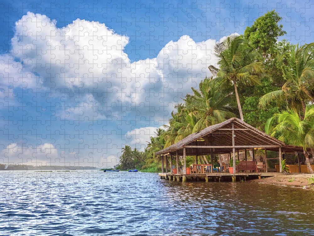 African Jigsaw Puzzle featuring the photograph Dockhouse Under the Palms by Debra and Dave Vanderlaan