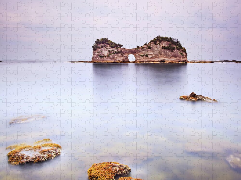 Island Jigsaw Puzzle featuring the photograph Hole island and rocks in a tropical blue ocean. Cloudy sky. by Stefano Orazzini