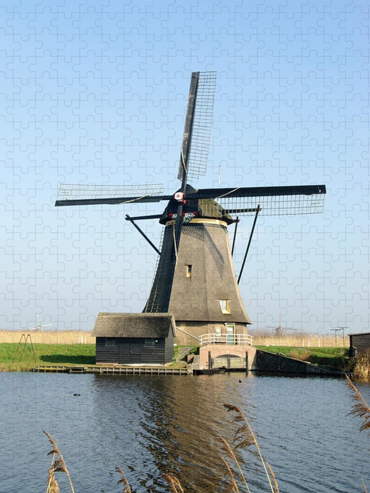 Windmill Jigsaw Puzzle featuring the photograph Kinderdijk Windmill by Jan Luit